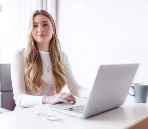 blond-woman-working-on-her-laptop-at-the-office-2022-09-29-21-50-36-utc-2